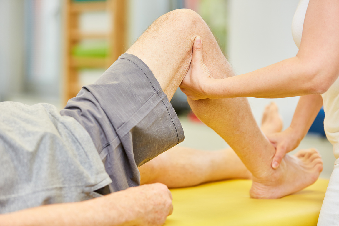Physiotherapist Treats Knee Joint with Osteopathy